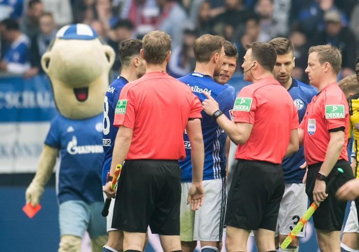 Schalke mascot Erwin shows red card to referee