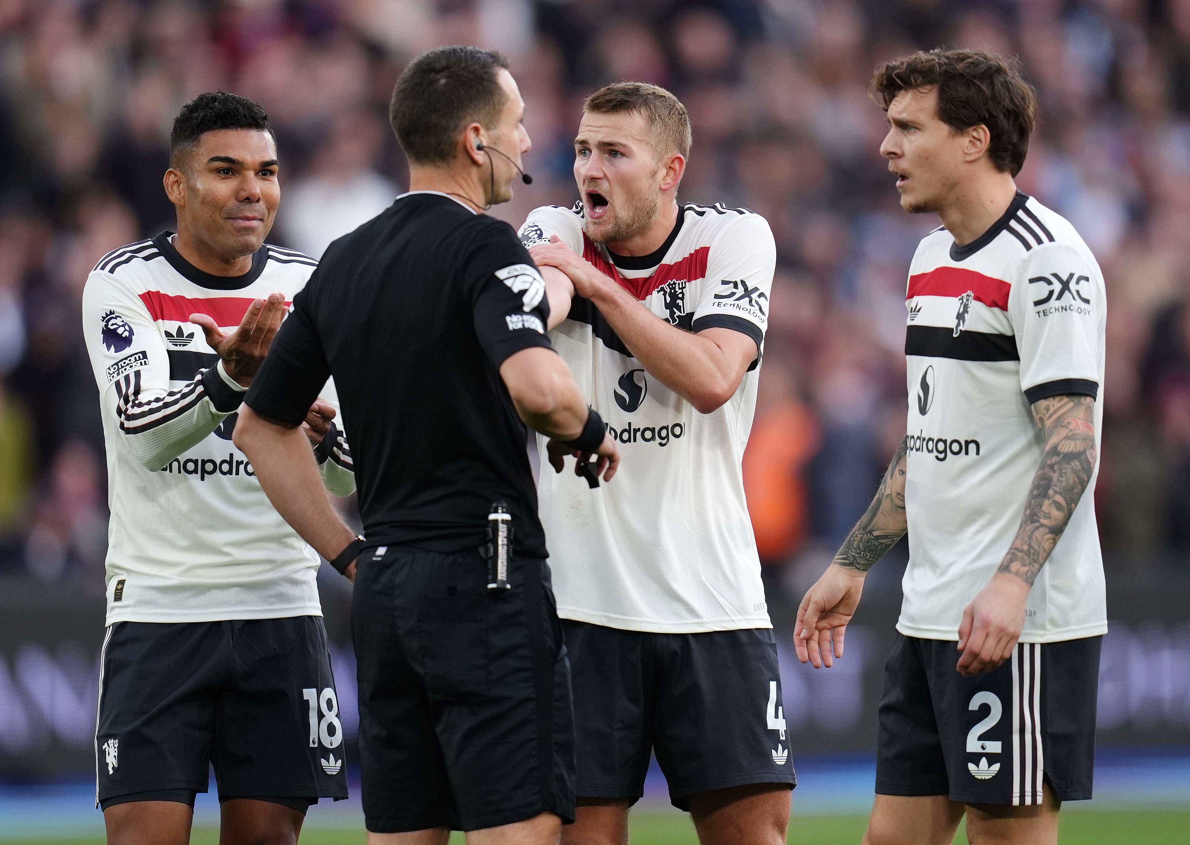 Manchester United’s Matthijs de Ligt (centre right) protests to referee David Coote (centre left) after he awarded a penalty to West Ham (John Walton/PA) (PA Wire)